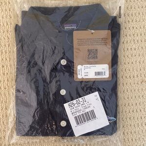 Patagonia collared shirt with tags. Smolder blue, Brand new, unopened.